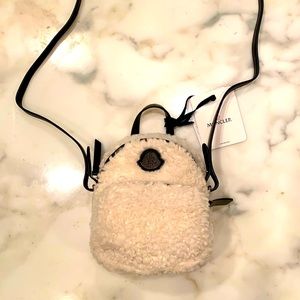 Small fur Moncler bag with the crossbody strap